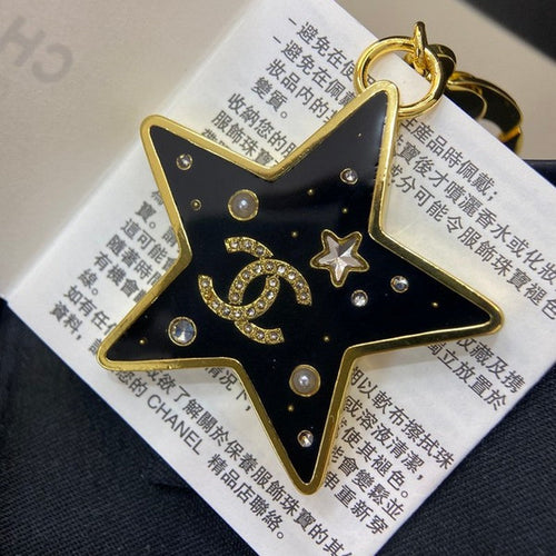 Chanel Black Gold Star 18K Gold Brooch