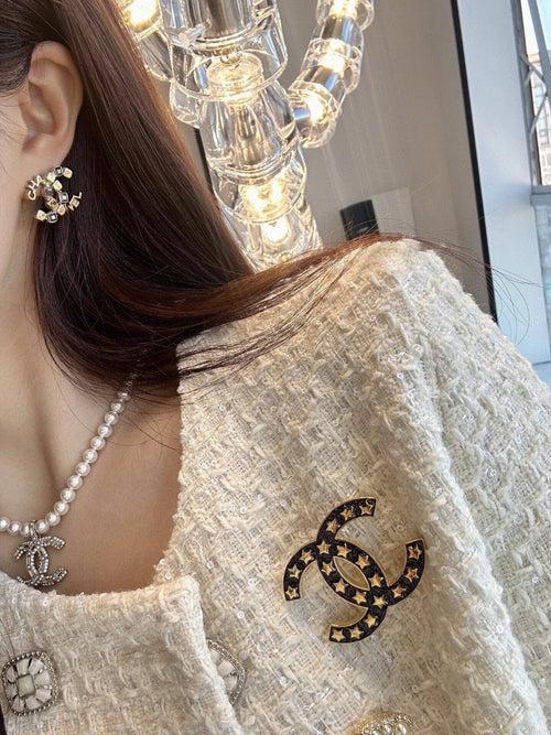 Chanel Black Star 18K Gold Brooch